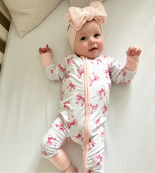 Pink and white bow design sleepsuit